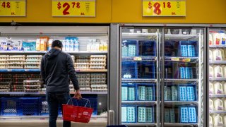 A customer shops for produce at an H-E-B grocery store on Feb. 12, 2025 in Austin, Texas.
