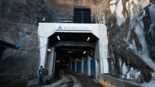 A man exits the Iron Mountain Inc. data storage facility in Boyers, Pennsylvania, U.S., on Tuesday, Feb. 13, 2018. The underground data center, located in a former limestone mine, stores 200 acres of physical data for many clients including the federal government.