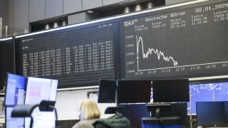 A trader at the Frankfurt Stock Exchange in Frankfurt, Germany, on Thursday, Jan. 2, 2025. European stocks slipped on the first trading day of the year, as sluggish economic data from China weighed on sectors such as automakers and luxury, which rely on the Asian country for a large portion of sales. Photographer: Alex Kraus/Bloomberg via Getty Images