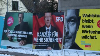 Election campaign billboards show the members of the previous government coalition, namely Robert Habeck (L) of the Greens Party, German Chancellor and Social Democrat Olaf Scholz (C) and Free Democrat (FDP) Christian Lindner.