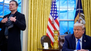 FILE - Elon Musk and President Donald Trump at an executive order signing in the Oval Office at the White House on Feb. 11, 2025.