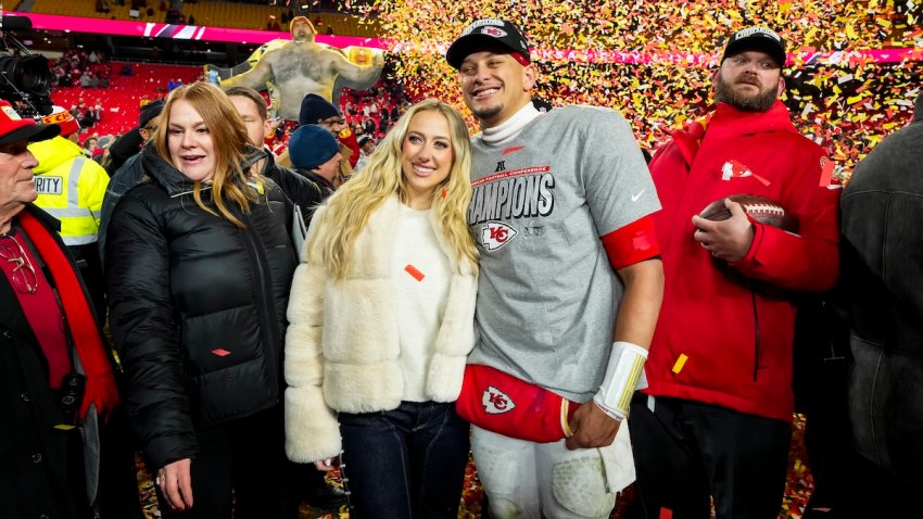 Quarterback Patrick Mahomes #15 of the Kansas City Chiefs poses for a photo with his wife Brittany Mahomes after the AFC Championship game against the Buffalo Bills