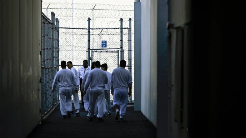 Detainees in a fenced recreation area during a media tour at the U.S. Immigration and Customs Enforcement detention facility in Tacoma, Wash., in 2019.