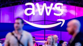 Attendees walk through an exposition hall at AWS re:Invent, a conference hosted by Amazon Web Services, in Las Vegas on Dec. 3, 2024.