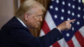 U.S. President Donald Trump points as he attends the annual Friends of Ireland luncheon hosted by U.S. House of Representatives Speaker Mike Johnson (R-LA) at the U.S. Capitol in Washington, D.C., U.S., March 12, 2025.