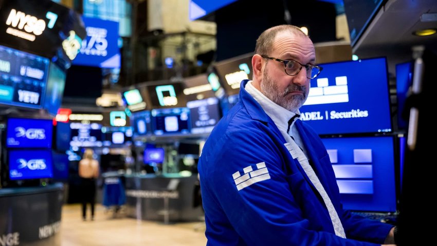 Traders work at the New York Stock Exchange on March 18, 2025. 