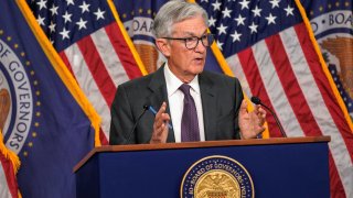 Fed holds interest rates steady, still sees two cuts coming this ...