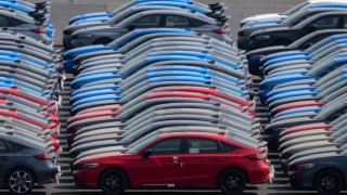 Vehicles awaiting shipment are parked at a port on March 27, 2025 in Yokohama, Japan. U.S.