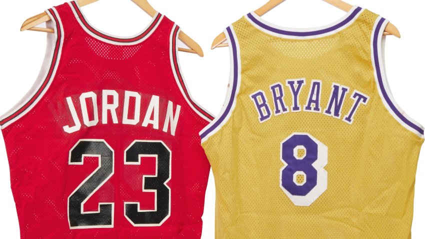 A michael jordan jersey and kobe bryant jersey on hangars