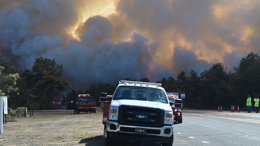 U.S. Air Force firefighters assigned to the 106th Rescue Wing respond to the Pine Barren Fire off Sunrise Highway on March 8, 2025. Base fire trucks, local departments, and an HH-60W Jolly Green II search and rescue helicopter were deployed in response to the fire. (U.S. Air National Guard Photo by Staff Sgt. Sarah McKernan)