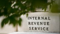 FILE - The sign outside the Internal Revenue Service building is seen. May 4, 2021, in Washington.