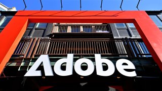 An Adobe sign hangs along Main Street during the 2025 Sundance Film Festival on Jan. 27, 2025 in Park City, Utah. 