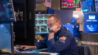 Traders work on the floor of the New York Stock Exchange on March 28, 2025, in New York City. 