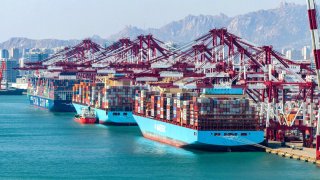 Aerial view of containers for export sitting stacked at Qingdao Qianwan Container Terminal on April 5, 2025 in Qingdao, Shandong Province of China. 