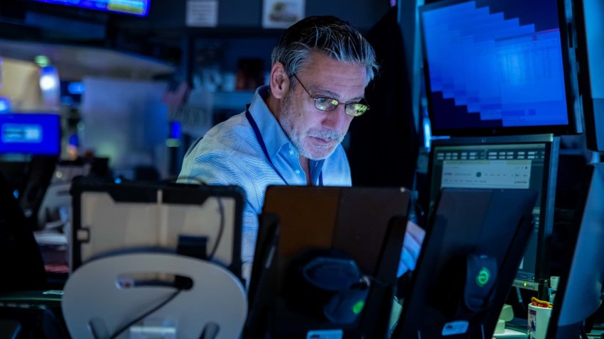 Traders work on the floor of the New York Stock Exchange on April 8, 2025. 
