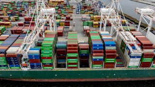 A cargo ship carrying shipping containers is moored to the pier at the Port of Baltimore on April 10, 2025, in Baltimore, Maryland. 