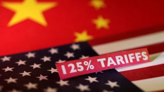 U.S. and Chinese flags and a “125% tariffs” label are seen in this illustration taken April 10, 2025.