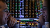 A trader works on the floor at the New York Stock Exchange (NYSE) in New York City, U.S., April 22, 2025.