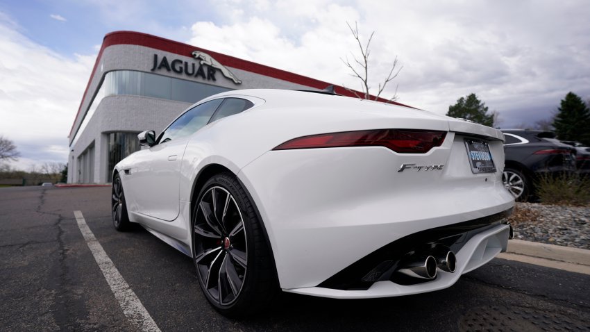 An unsold 2021 F-Type coupe sits at a Jaguar dealership