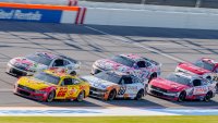 Apr 26, 2025; Talladega, Alabama, USA; NASCAR Cup Series driver Joey Logano (22) leads the pack going into turn one at Talladega Superspeedway. Mandatory Credit: Jason Allen-Imagn Images