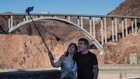 Visitors pose for a selfie at Lake Mead, the country’s largest man-made water reservoir, formed by the dam on the Colorado River in the Southwestern United States.