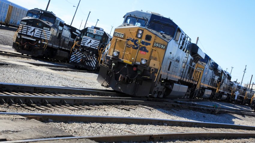 Norfolk Souther Rail and a CSX train sit at the Norfolk Southern Bellevue Terminal in Bellevue, Ohio.