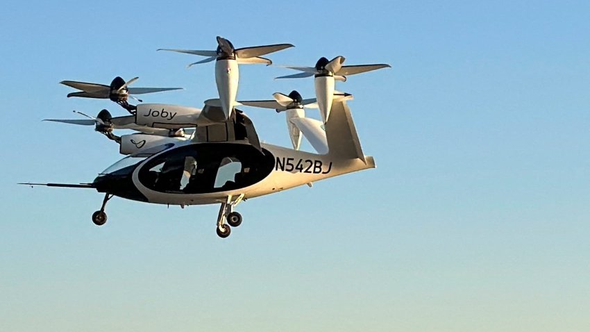 An electric air taxi by Joby Aviation flies near the Downtown Manhattan Heliport in Manhattan, New York City, U.S., November 12, 2023. 