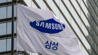 A Samsung Group flag flutters in front of the company’s Seocho building in Seoul. 