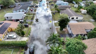 An aerial view of a flooded residential neighborhood street after localized heavy rain on December 18, 2024 in Fort Lauderdale, Florida.