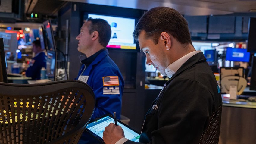 Traders work on the New York Stock Exchange  floor on April 28, 2025 in New York City.