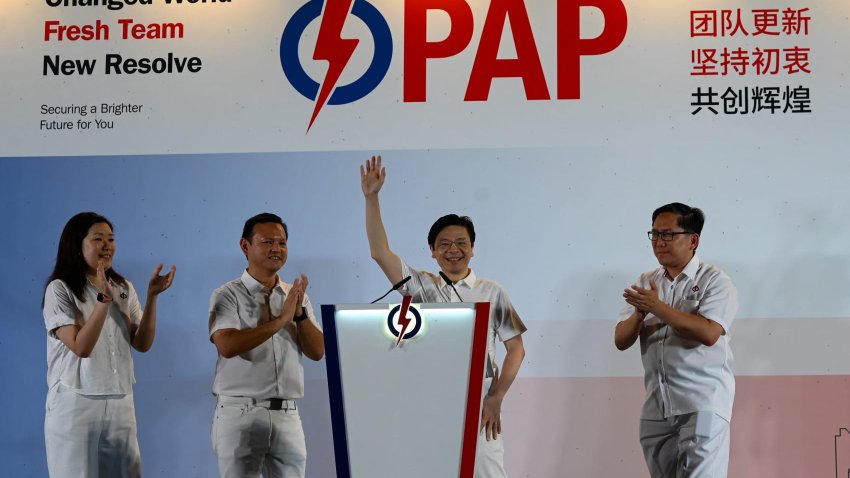 Singapore Prime Minister Lawrence Wong of the People’s Action Party (PAP) waves to supporters as he celebrates at the party’s gathering center during the general election results, in Singapore on May 3, 2025.