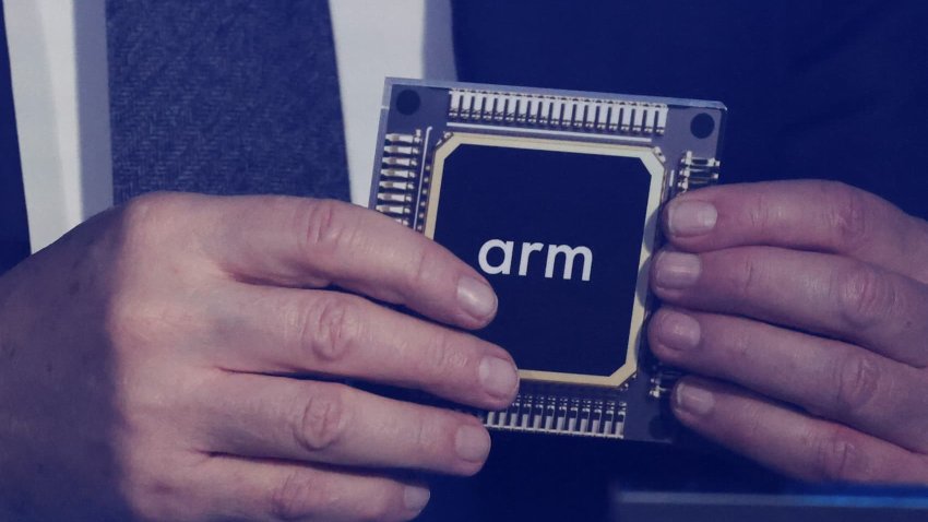 Rene Haas, CEO of chip tech provider Arm Holdings, holds a replica of a chip with his company’s logo on it, during an event in which Malaysia’s Prime Minister Anwar Ibrahim officially announces a $250 million deal with the company, in Kuala Lumpur, Malaysia March 5, 2025.