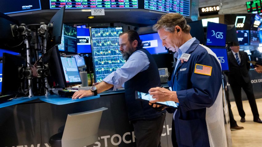 Traders work on the floor of the New York Stock Exchange on May 7, 2025.