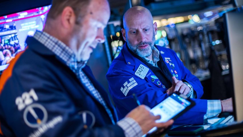 Traders work at the New York Stock Exchange on May 9, 2025.