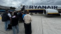 People board Ryanair plane at Rome Ciampino Airport in Ciampino, Italy on April 27, 2025.
