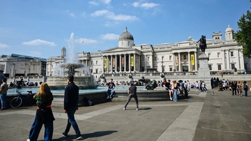 People walk in Trafalgar Square, London, on April 28, 2025.
