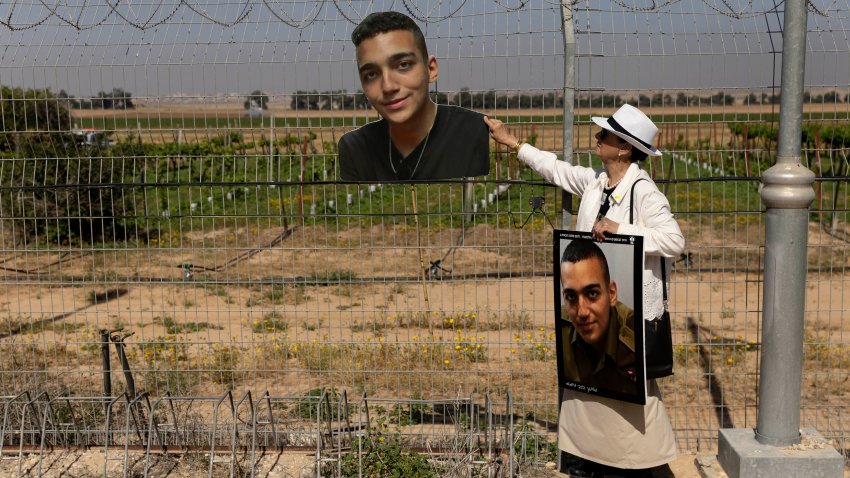 Varda Ben Baruch holds a photo of her grandson Israeli-American hostage Edan Alexander