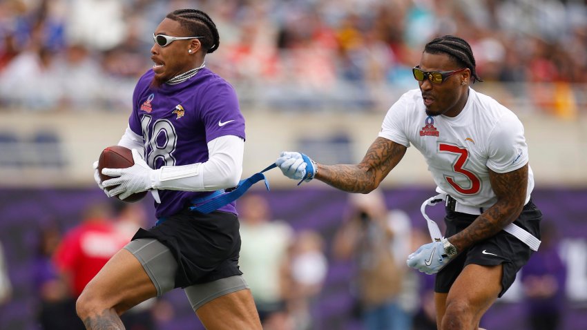 Justin Jefferson has his flag pulled by Derwin James