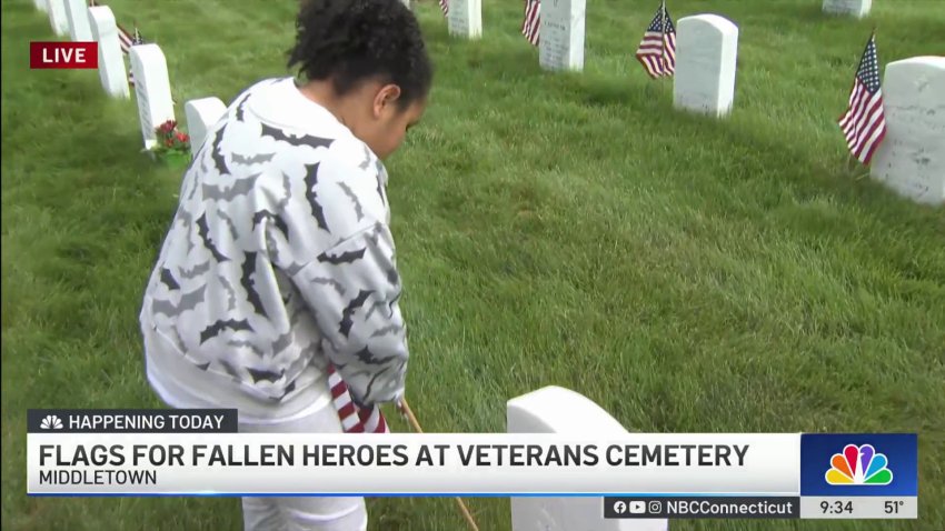 Scouts honor fallen heroes by placing flags at State Veterans Cemetery in Middletown