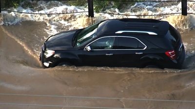Video shows firefighters rescue driver stranded in San Antonio floods
