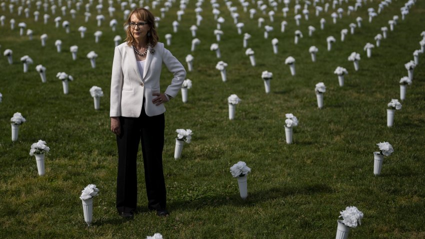 Former congresswoman and gun violence survivor Gabby Giffords walks through the Gun Violence Memorial in front of the Washington Monument on June 7, 2022, in Washington, D.C.