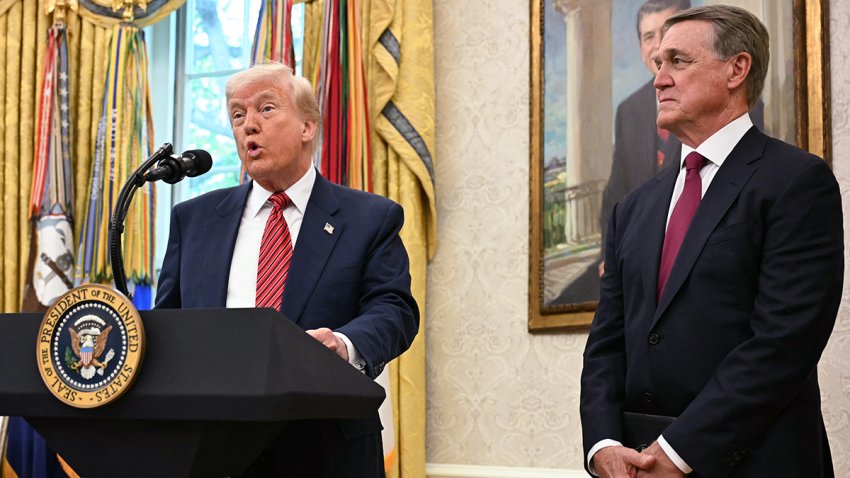 President Donald Trump participates in a swearing-in ceremony for the Ambassador to China, former Republican Sen. David Perdue, in the Oval Office on May 7, 2025.