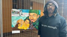 Artist Sadafa Mustafa with the scholarship site next to his work of art, in which premature babies are emphasized.