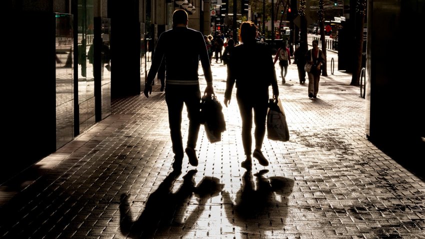 Shoppers carry bags on Market Street in San Francisco, California, US, on Wednesday, Nov. 13, 2024.
