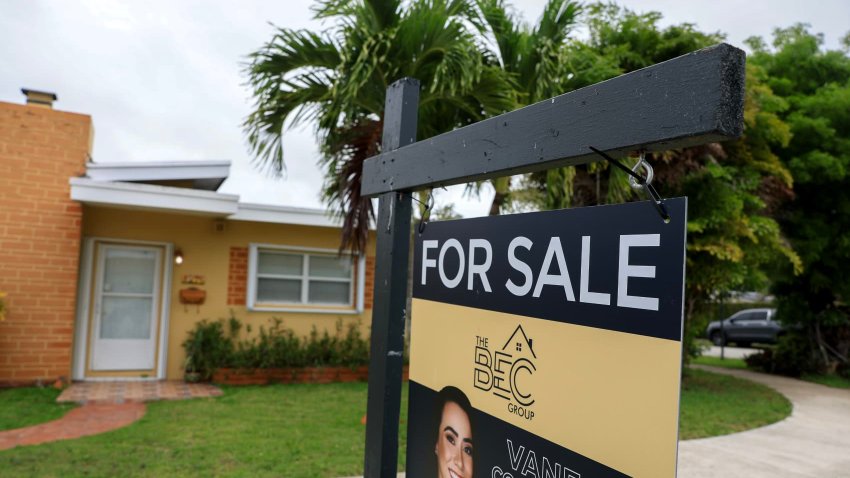 A For Sale sign sits in front of a home on May 12, 2025 in Miami, Florida.