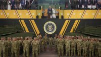 U.S. President Donald Trump and First Lady Melania Trump stand together at the end of the U.S Army parade on June 14, 2025 in Washington, DC.