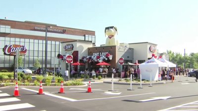 People brave the heat in line for grand opening of Raising Cane's in Wethersfield