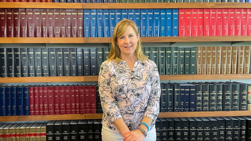 State Rep. Melissa Hortman stands in front of Minnesota law books in her office in St. Paul in 2023.