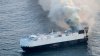 22 crew members rescued from lifeboat in North Pacific after ship carrying 3,000 cars catches fire