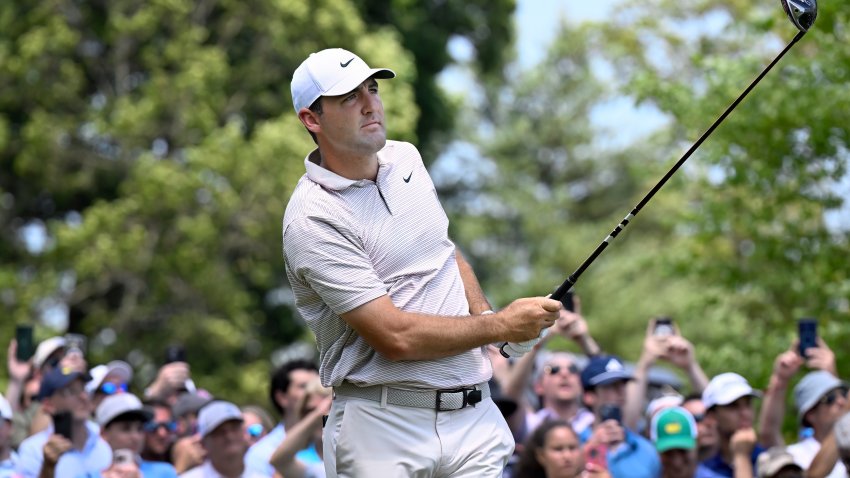 Scottie Scheffler watches his shot from the first tee during the first round of the Travelers Championship golf tournament at TPC River Highlands, Thursday, June 19, 2025, in Cromwell, Conn.